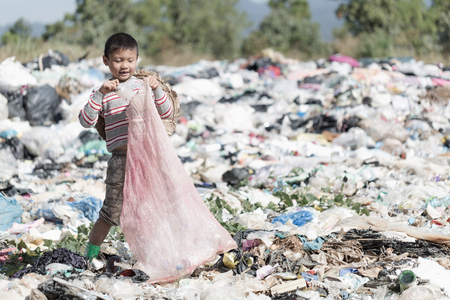 Poor children collect garbage for sale because of poverty, Junk recycle, Child labor, Poverty concept, World Environment Day,の写真素材