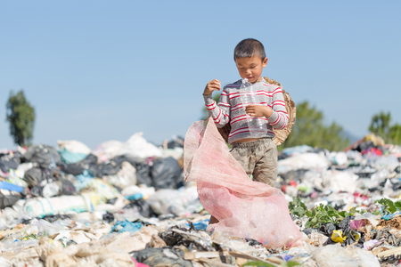 Poor children collect garbage for sale because of poverty, Junk recycle, Child labor, Poverty concept, World Environment Day,の写真素材