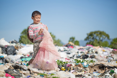 Poor children collect garbage for sale because of poverty, Junk recycle, Child labor, Poverty concept, World Environment Day,の写真素材
