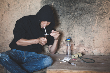 Man taking heroin, cocaine or other narcotic substance,  Drug abuse and addiction concept,  26 June International Day Against Drug abuse.の写真素材