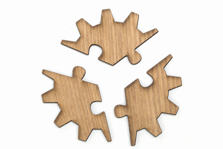 Wooden jigsaw puzzle, pieces of a puzzle, gear,  Isolated on White Backgroundの写真素材