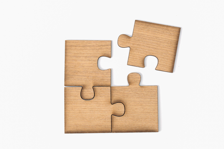 Wooden jigsaw puzzle, pieces of a puzzle, Last Jigsaw Puzzle, Isolated on White Backgroundの写真素材