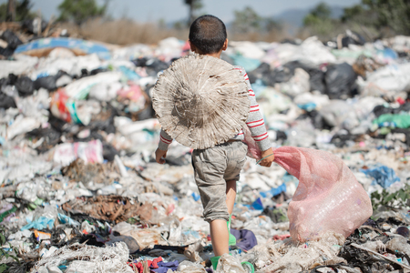 Children find junk for sale and recycle them in landfills, the lives and lifestyles of the poor, Poverty and Environment Conceptsの写真素材