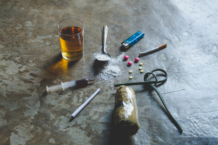 Drugs of various kinds on the floor, Collection of different hard drugs Heroin, Pills,  Tobacco and alcohol, Addiction conceptの写真素材