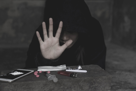 Stop drug addiction concept. Human hands stop drugs . International Day against Drug Abuse.の写真素材