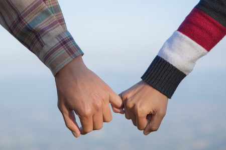 Happy couple in love. Man and woman tourists in the mountains. Happy Valentine's Day.