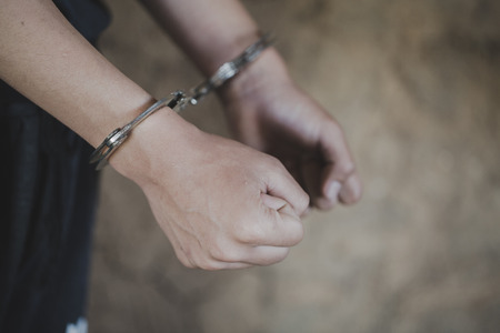 The slave girl was handcuffed and kept. Women violence and abused concept, Imprisonment, Female prisoner,  human trafficking Concept, international women's day.の写真素材