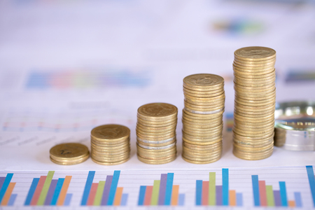 Coins stacked on each other in different positions, Money saving, financial risk management, business investmentの写真素材