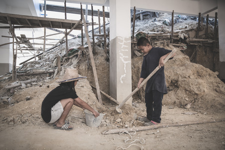 The concept of child labor, Poor children are forced to work in construction, Violence children and trafficking concept,  Rights Day,  World Day Against Child Labour conceptの写真素材