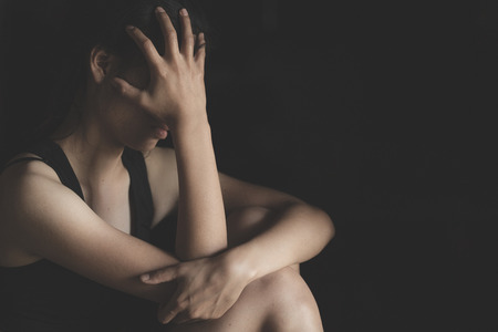 woman sitting on ground, sexual violence , sexual abuse, Domestic Violence, human trafficking concept.の写真素材
