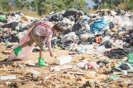 Poor children collect garbage for sale because of poverty, Junk recycle, Child labor, Poverty concept, human trafficking, World Environment Day,の写真素材
