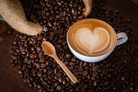 coffee latte with coffee beans  on dark background, top viewの写真素材