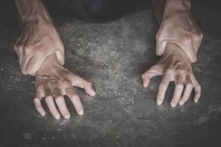 Man's hand holding a woman hand for rape and sexual abuse,   problem or Social issues concept.の写真素材