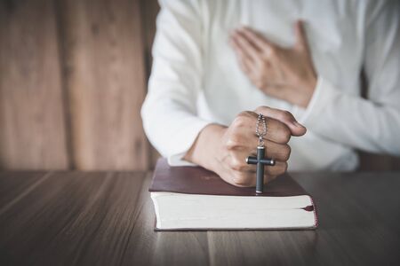 Religious young woman praying to God in the morning, spirtuality and religion, Religious conceptsの写真素材
