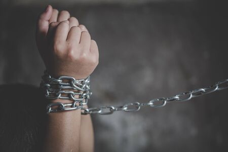 Abused Boy Sitting on the Floor with Chain on hand  with Copy Spac, Children violence and abused...