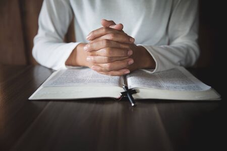 Religious young woman praying to God in the morning, spirituality and religion, Religious concepts