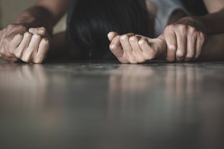 Man's hand holding a woman hand for rape and sexual abuse,  Hands for rape and sexual abuse concept,...