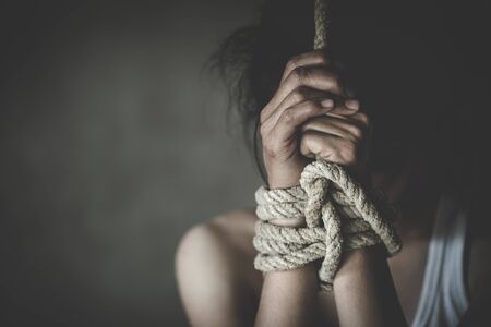 victim woman tied up with rope in emotional stress, rape and sexual abuse, Human trafficking, Stop...