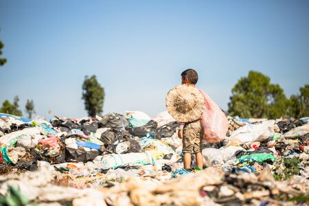 Poor children collect garbage for sale because of poverty, Junk recycle, Child labor, Poverty concept, World Environment Day,の写真素材