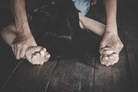 Men who are raping women, domestic violence, The concept of sexual harassment against women and rape, International Women's Dayの写真素材