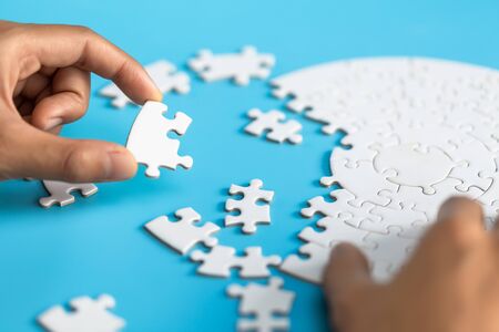 Hand connect jigsaw parts with word problem & solution.   symbol of association and connection....