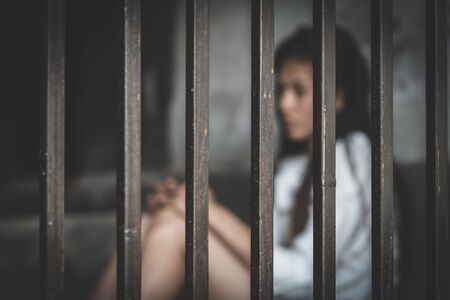 Desperate people are in a dark cell. Human trafficking, Stop abusing violenceの写真素材