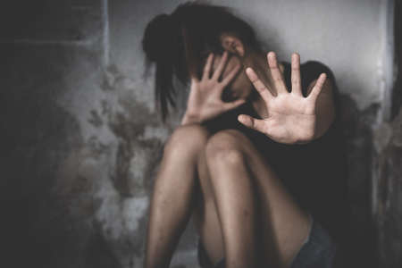 woman raised her hand for dissuade, campaign stop violence against women, including rape and human...