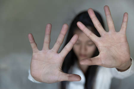 woman hand show stop sign, Stop harassment and abuse in relationship.