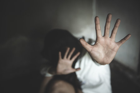 Women raising hands against  violence. Stop sexual harassment and violence against women, domestic...