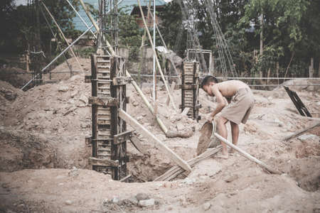 Child labor, children are forced to work construction, Violence children and trafficking concept, Anti-child labor, Rights Day on December 10の写真素材