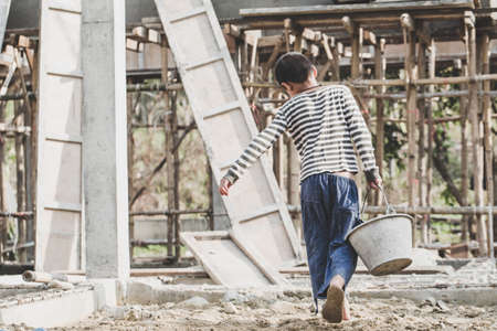 The concept of child labor, Poor children are forced to work in construction, Violence children and trafficking concept,  Rights Day,  World Day Against Child Labour conceptの写真素材