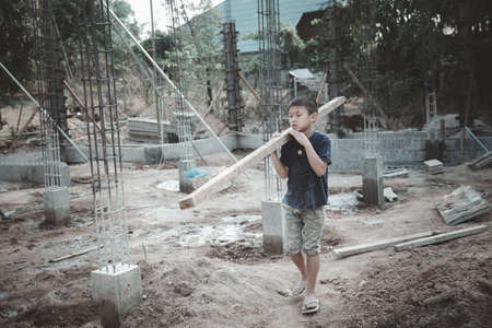 Children working at construction site.  world day against child labor conceptの写真素材