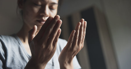 Christian life crisis prayer to god. Woman Pray for god blessing to wishing have a better life. woman hands praying to god.の写真素材
