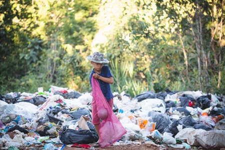 Poverty concept, Poor children collect garbage for sale because of poverty, Junk recycle, Child...