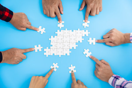 Business team connect puzzle pieces white blue background unity cooperation conceptの写真素材