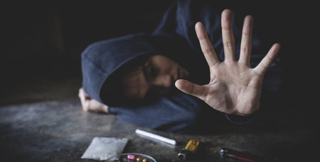 Stop drugs concept. A woman making a stop gesture to drugs, Human hands stop drugs . International Day against Drug Abuse.の写真素材