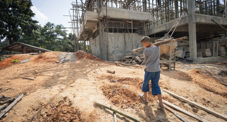 boys labor work in the construction site,  Against child labor, Poor children,  construction work, Violence children and trafficking conceptの写真素材