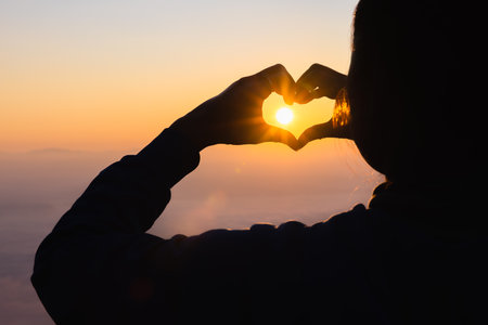 Silhouette of Human hands open palm up worship. Eucharist Therapy Bless God Helping Repent Catholic Easter Lent Mind Pray. Christian Religion concept background. fighting and victory for god.の写真素材