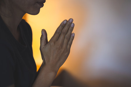 Hands folded in prayer concept for faith, Religious young woman praying to God in the morning, spirtuality and religion, Religious concepts.の写真素材