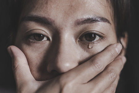 Crying woman. The concept of ââstopping violence against women and the abuse of defenseless women, International Day for the Elimination of Violence against Women.の写真素材