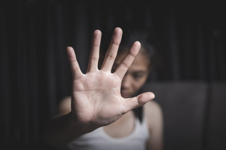 The concept of eliminating violence against women. A woman's hand symbolizing the fight for women. International Day for the Elimination of Violence against Women.の写真素材