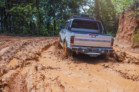 Off road car. Offroad car on bad road. Mud and water splash in offroad racing. Offroad car...