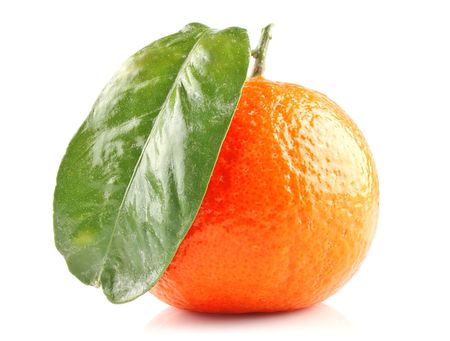 Ripe orange mandarine fruit with green leaf. Isolated on white backgroundの写真素材