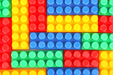 Plastic building blocks background, colorful children