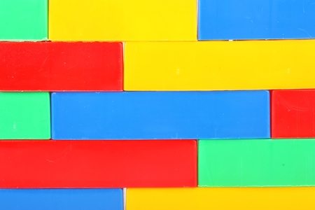 Plastic building blocks background, colorful children's toys