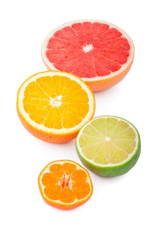 Half of fresh citrus fruits, isolated on white backgroundの写真素材