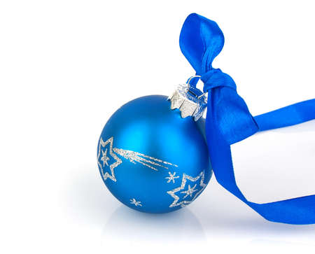 Christmas ball with blue ribbon on whiteの写真素材