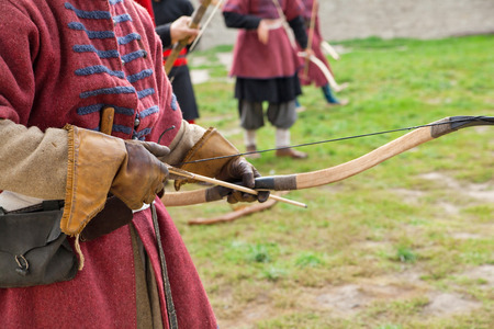 Archer with bow and arrows in medieval costume aimingのeditorial素材