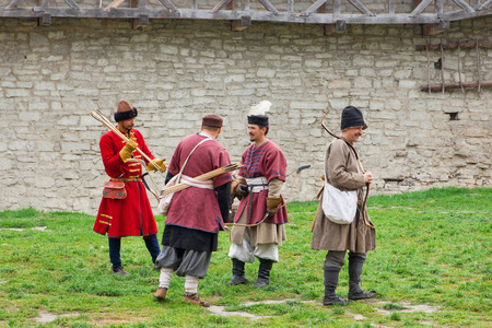 Archers with bow and arrows in medieval costume aiming, editorial photoのeditorial素材