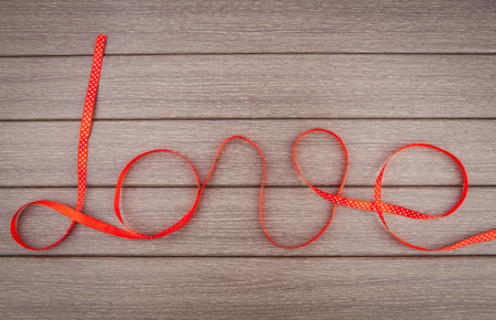 Word love of red ribbon, vector illustrationの写真素材